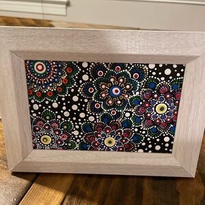 Hand painted in dot mandala style, sealed w/frame